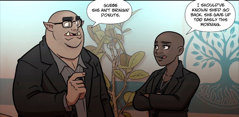 Inside a hospital waiting area, police detectives â€˜Zug and Aâ€™isha stand near a potted plant, conversing. â€˜Zug, a large half-orc man with glasses and tusks, gestures casually while wearing a suit. Aâ€™isha, a bald human woman in a blazer, stands with her arms crossed and a knowing expression. A decorative tree design is visible on the wall behind them.